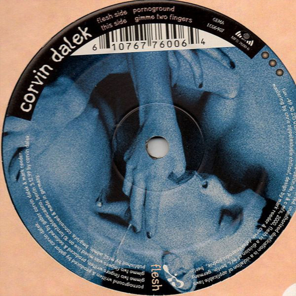 Vinyl label for Corvin Dalek’s 12″ single Pornoground / Gimme Two Fingers, Flesh, 2000.